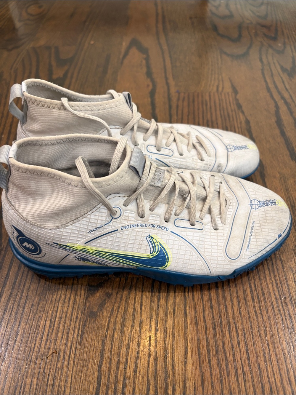 Nike Kids White High-Top Turf Sneakers with Blue and Neon Yellow Accents